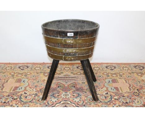 19th century oak and brass bound oval plant trough on four splayed legs, 57cm high