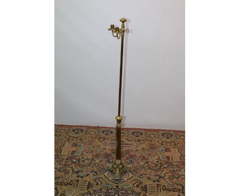 19th century brass adjustable lamp standard candlestick, on paw feet, 125cm high