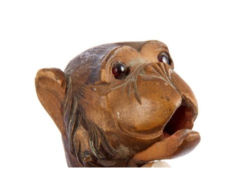 Late 19th century novelty walking stick with carved wooden monkey head knop with glass eyes and sprung-opening mouth, with wh