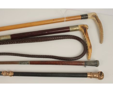 Ladies' silver mounted hunting crop with stag horn handle, another with lash, early 20th century yellow metal mounted whip by