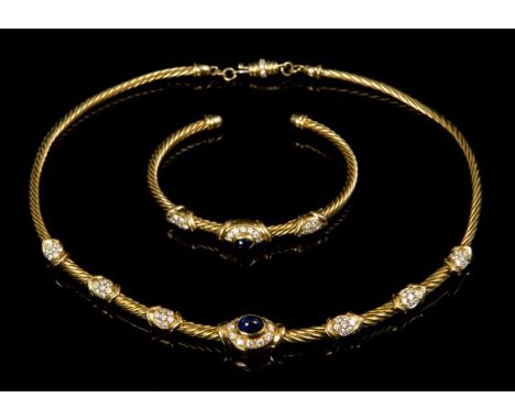 Gold (18ct) sapphire and diamond necklace and torque bangle, each with an oval cabochon blue sapphire surrounded by diamonds 