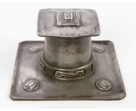 Early 20th century Archibald Knox Tudric pewter inkwell with stylised floral medallions and original glass liner, marked 'Tud