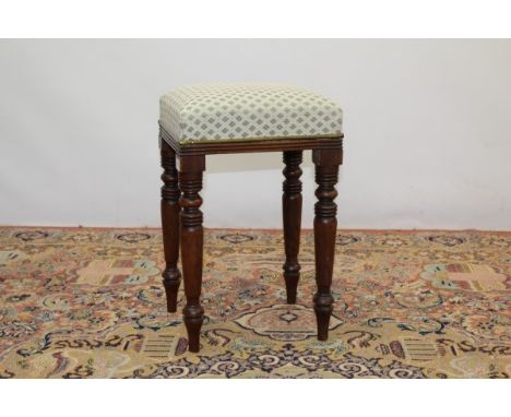 Early 19th century stool with upholstered seat on turned mahogany legs, 52cm high