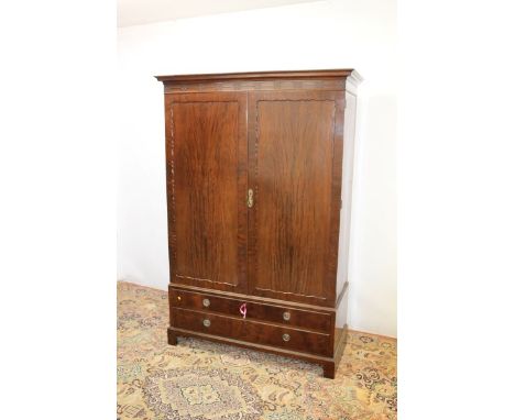 Edwardian mahogany wardrobe with blind fretwork decoration, two panelled doors and two drawers below, on bracket feet, 195cm 