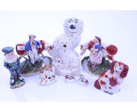 Group of mixed Victorian Staffordshire figures comprising: seated single spaniel, seated spaniel with pup, pair of standing c