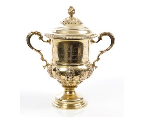 Fine quality George V silver gilt two-handled cup and cover of campana form, with applied classical masks, decorative scroll 
