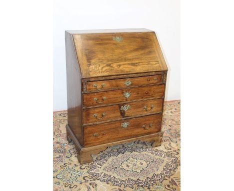 Georgian elm bureau with fitted interior and four long graduated drawers below, on bracket feet, 108cm high x 79cm wide x 48c