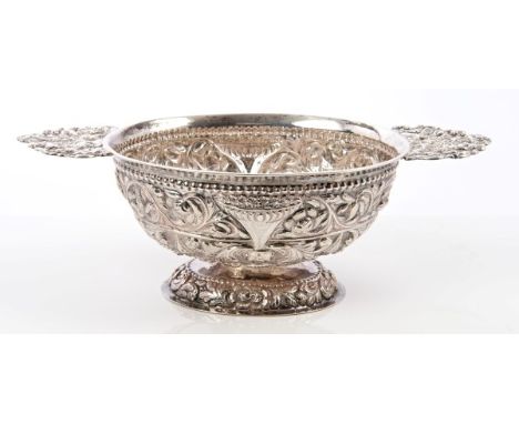 Dutch silver two-handled dish of oval form, with chased and engraved foliate and bead decoration, cast handles with classical