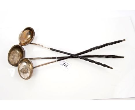 Georgian silver toddy ladle with oval bowl, engraved crest and whalebone handle (circa 1800) and two others (3)