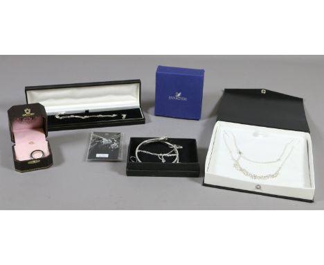 A collection of boxed silver jewellery to include Swarovski earrings, a 925 stamped bangle, earring and pendant set and an Am