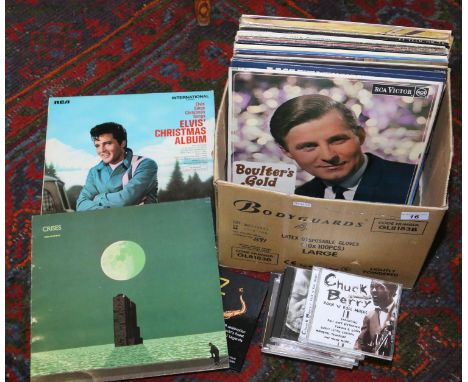 A collection of L.P records and compact discs to include rock and roll etc.