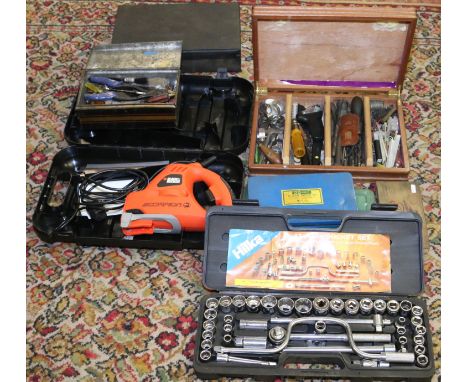 Eight cases of tools to include a tap and die wrench set, 42 piece socket set and a Black & Decker Scorpion saw.