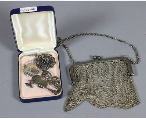 A ladies silver plate mesh evening bag and a silver locket brooch in the form of a Viking axe etc.