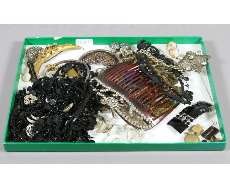 A collection of vintage costume jewellery to include French jet, gem set bangles, brooches, fob chain with T-bar, etc.