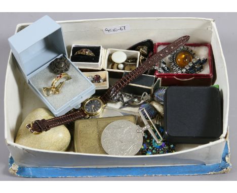 A box of costume jewellery to include rings, brooches, Defence Medal, Zippo lighter, etc.