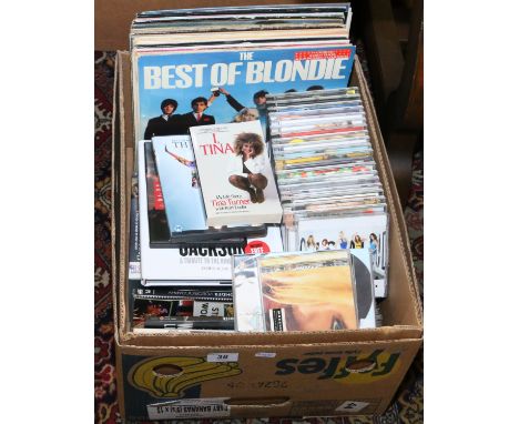 A box and contents of L.P records and compact discs, rock, pop and easy listening etc.