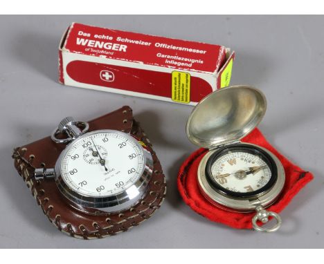 A chrome plate stopwatch by Smiths in original box with protective leather wallet along with a Wenger Swiss army knife and co