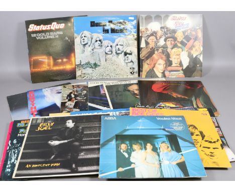 A collection of L.P records to include rock and easy listening by artists Deep Purple, Status Quo and Electric Light Orchestr