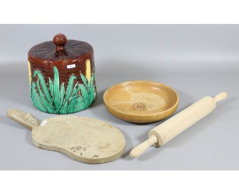 A Robert Thompson 'Mouseman' cheese board along with a rolling pin, Pearson of York turned oak fruit bowl and a majolica chee