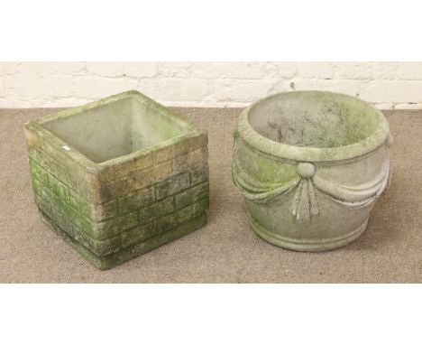 A circular garden planter along with a square formed planter.