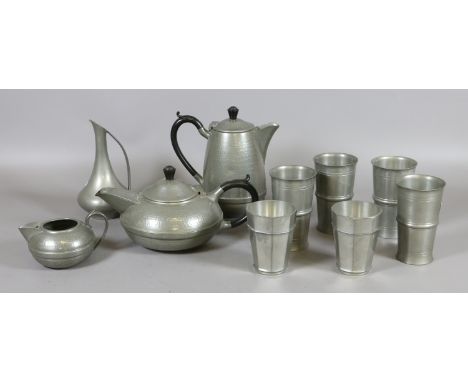 A three part Sheffield pewter tea service along with six goblets and a vinegar jug.