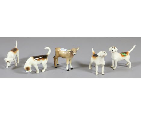 A Beswick model of a Jersey calf along with four Beswick hunting hounds.