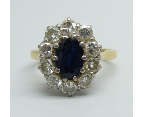 An 18ct gold, sapphire and diamond cluster ring, 4.9g, O, approximately 1ct total diamond weight 