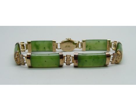 A silver gilt and jade bracelet 