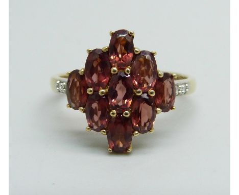 A 9ct gold and garnet cluster ring, 3g, P/Q 