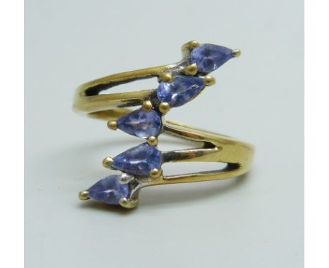 A silver gilt tanzanite crossover ring, N 