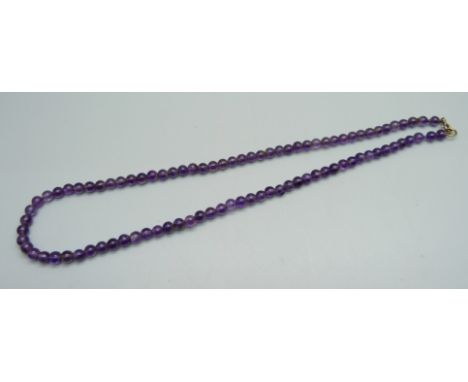 A vintage amethyst bead necklace with a 9ct gold fastener, 42cm 