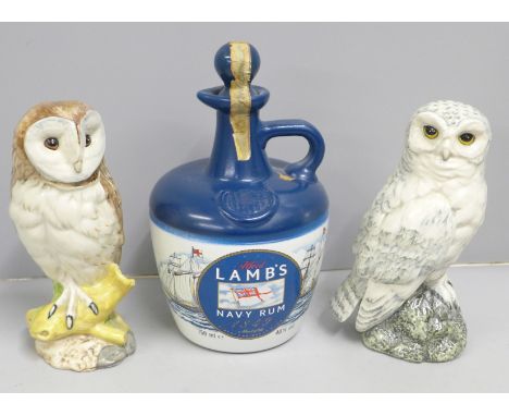 Two Whyte &amp; Mackay scotch whisky decanters - barn owl and snowy owl and a bottle of Alfred Lamb's navy rum, all with cont