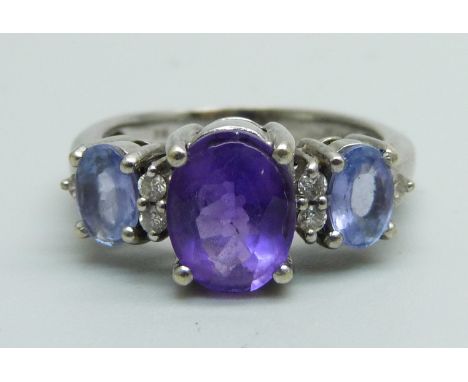 A 14ct white gold and three stone amethyst and six stone diamond ring, 4.8g, N 