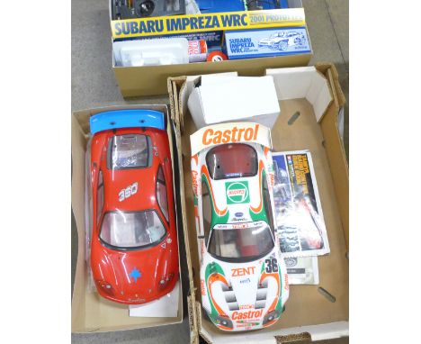 A Tamiya Subaru Impreza WRC 1/10th scale radio control 4WD high performance rally car, boxed, car body shells, Toyota and Fer