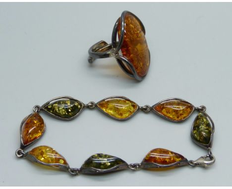 A silver and amber cocktail ring, K/L, and a silver and amber bracelet 