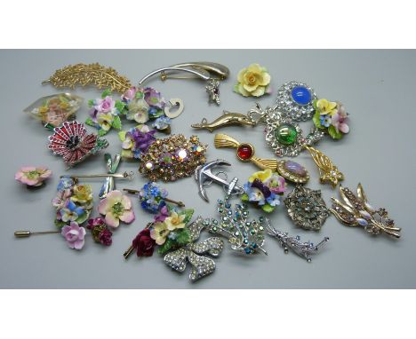 Thirty-one costume brooches, two pairs of earrings and a stick pin 