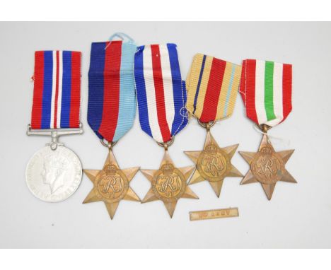 WWII medals: Africa Star with 8th Army clasp, Italy Star, France and Germany Star, 1939-1945 Star and medal, awarded to W.A.W