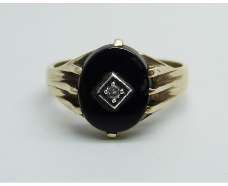 A 9ct gold, onyx and diamond signet ring, 3.8g, T 