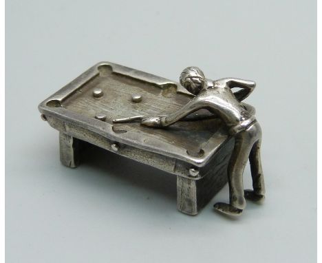 A miniature hallmarked silver billiards table and player, 20g, 35mm 