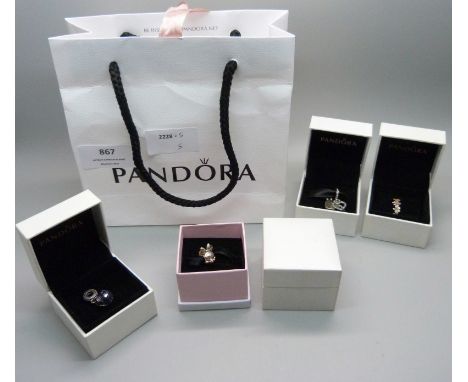 Three Pandora charms including one Disney and a Pandora ring 