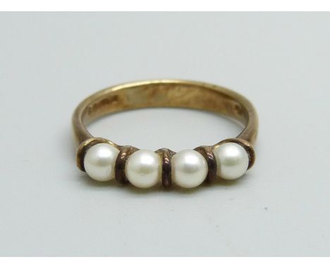 A 9ct gold ring set with four pearls, 2.1g, L 