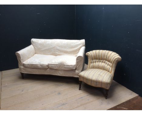 2 seater sofa with cream upholstery & mahogany legs 135L x 70H cm (1 back leg damaged) (lots 646 to 667 cleared from country 