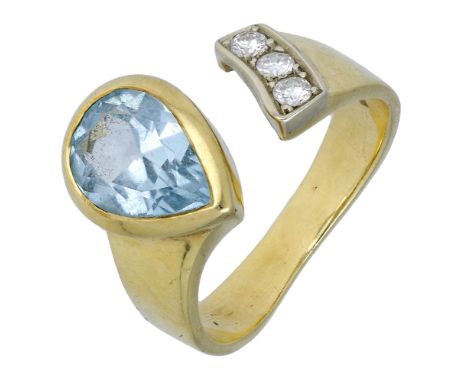 An 18ct gold blue topaz and diamond ring by Manfredi, the open terminals set with a pear-shaped blue topaz and a trio of bril