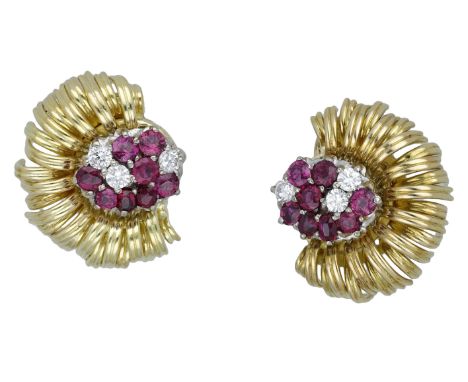 A pair of ruby and diamond ear clips by Deakin & Francis, 1987, each set with a cluster of vari-cut rubies and brilliant-cut 