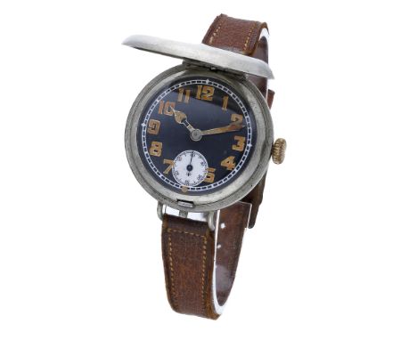 Swiss. A nickel trench watch with hinged dial cover, circa 1917.  Movement: manual winding, lever escapement. Dial: black ena