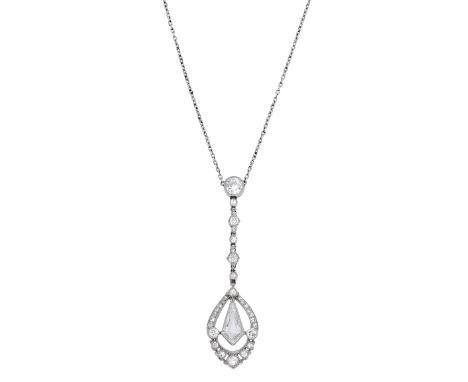 A diamond pendant, circa 1910, the teardrop-shaped pendant centred with a kite-shaped diamond within a surround of old-cut an