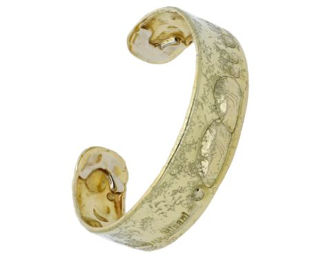 An 18ct gold torque bangle by Misani, the bangle of abstract design and hammered textured finish, with Italian assay marks, s