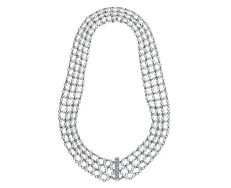 A seed pearl collar necklace, the uniform seed pearl lattice joined by chain connections, to a brilliant-cut diamond set clas