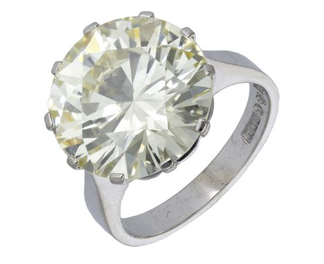 A diamond single stone ring, set with a brilliant-cut diamond of yellow tint, weighing 10.13 carats, Swedish assay marks for 