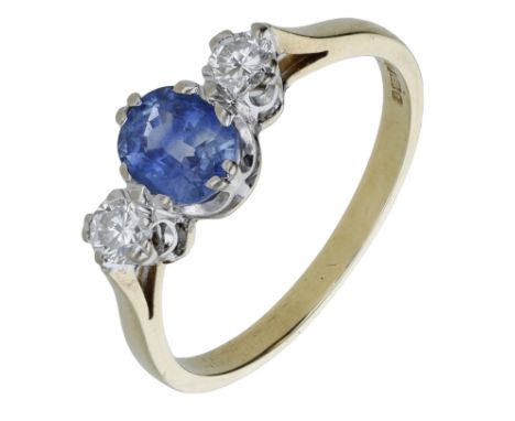 An 18ct gold three stone sapphire and diamond ring, the oval-mixed cut sapphire claw-set between two brilliant-cut diamonds, 